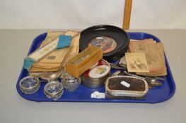 Tray of various mixed items to include a framed Pratt ware pot lid, a group of assorted postcards,