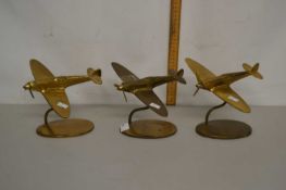 Group of three brass model aircraft