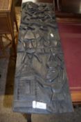 An African hardwood panel decorated with figures , 80cm high