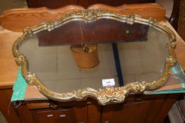 20th Century wall mirror in gilt floral decorated frame, 66cm wide