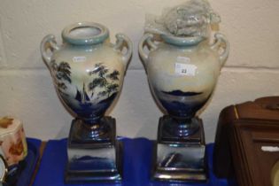 A pair of early 20th Century lustre finish urn style vases