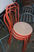 Three stacking metal framed chairs