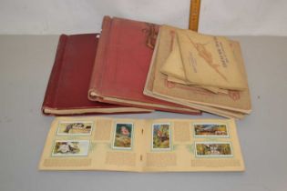 Mixed Lot: Albums various cigarette cards together with two albums of world stamps