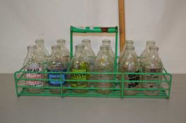 A crate of vintage milk bottles