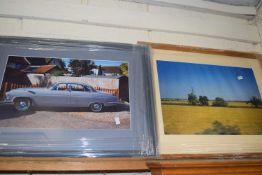 Photographic print of a summer field and a further print of a motor car