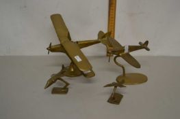 Four brass models of aircraft