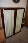 A mahogany glazed two door cabinet (Item 105 on the vendor list)