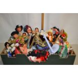 Box containing a large collection of costume dolls