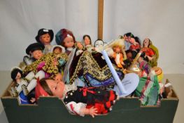 Box containing a large collection of costume dolls