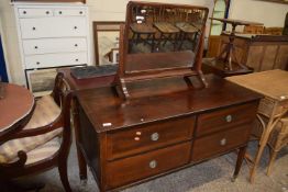 An Edwardian mahogany four drawer dressing chested together with a related swing dressing table