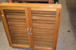 A mid Century glazed wall display cabinet with shelved interior