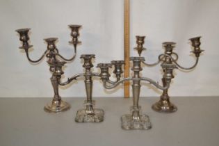 Two pairs of silver plated candelabra