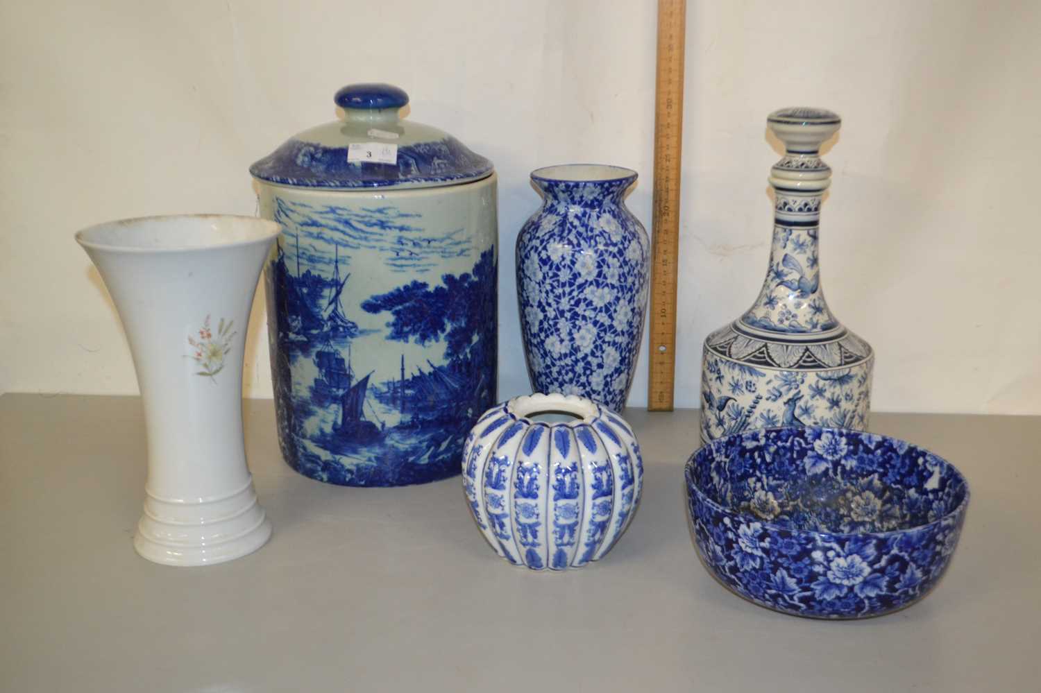 Mixed Lot: A reproduction blue and white iron stone cylindrical jar together with various vases,