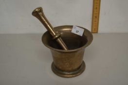 A vintage brass pestle and mortar