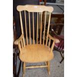A mid Century Ercol style stick back rocking chair
