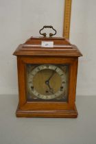 A 20th Century Elliott mantel clock in hardwood case bearing Manchester retailers stamp