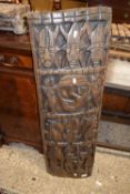 An African hardwood panel decorated with figures