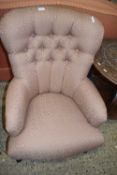 A Victorian style button back armchair