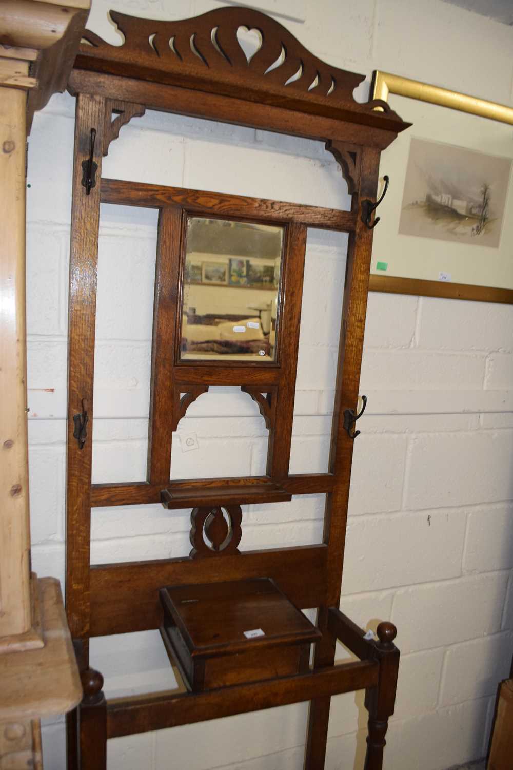 An early 20th Century mirror back oak hall stand (Item 49 on vendor list)