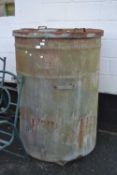 A large cylindrical metal container with tap (a/f)