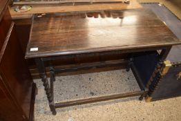 An early 20th Century oak side table on barley twist legs, 91cm wide
