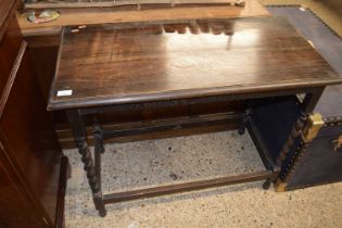 An early 20th Century oak side table on barley twist legs, 91cm wide