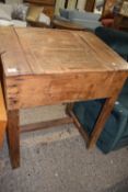 Late 19th or early 20th Century pine clerks desk with sloped hinged lid and storage interior