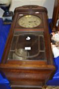 An early 20th Century oak cased wall clock