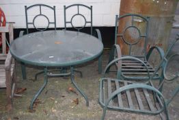Glass topped garden table and four iron framed chairs (5)
