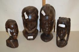 A pair of hardwood carved figure heads, approx 25cm high together with another pair, smaller