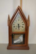 A mantel clock by The New England Clock Company