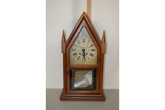 A mantel clock by The New England Clock Company