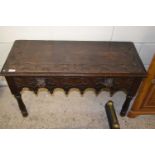 A small carved oak side table with lion mask handles (Item 5 on vendor list)