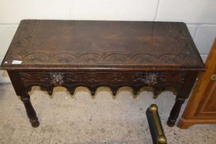 A small carved oak side table with lion mask handles (Item 5 on vendor list)