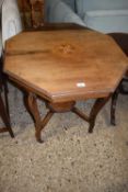 An Edwardian inlaid octagonal two tiered occasional table (Item 90 on vendor list)