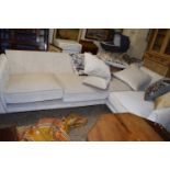 A modern corner sofa with scatter cushions, 270cm long maximum