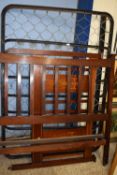 An Edwardian mahogany double bed frame with sprung base