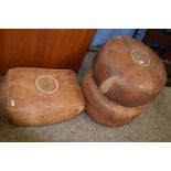 A pair of vintage circular leather covered pouffe together with a rectangular leather covered pouffe