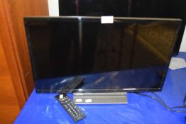A Toshiba LCD TV with remote control