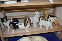 Quantity of dog figurines to include Border Collie, Old English Sheepdog, Bassett Hound etc