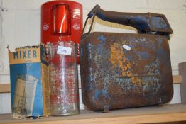 A vintage glass Horlicks jug and a vintage oil can