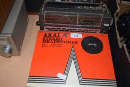 An Akai headphones box containing various leads together with an Hitachi radio