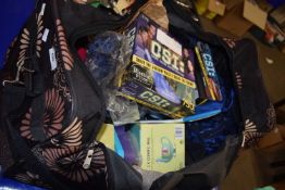 A holdall with a quantity of assorted games, mugs and other items