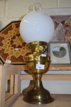 Brass based oil lamp with glass shade