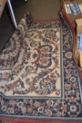 A cream ground red and blue rug