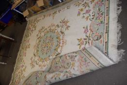Cream ground floral decorated wool rug, approx 3m square