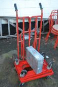 A metal sack barrow plus two further plastic framed trolleys and a metal box (4)