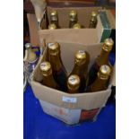 Six bottles of Brut together with six bottles of Charmaine Fizz