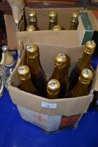 Six bottles of Brut together with six bottles of Charmaine Fizz