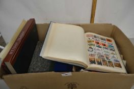 A large box of various assorted albums of world stamps and further loose
